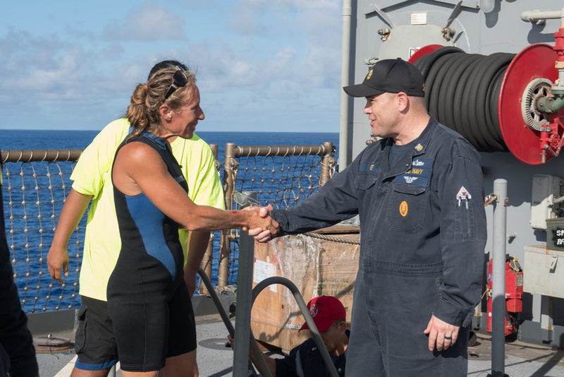 USS Ashland Command Master Chief Gary Wise welcomes aboard Jennifer Appel, an American mariner who had received assistance from Ashland crew members. (U.S. Navy photo by Mass Communication Specialist 3rd Class Jonathan Clay/Released)